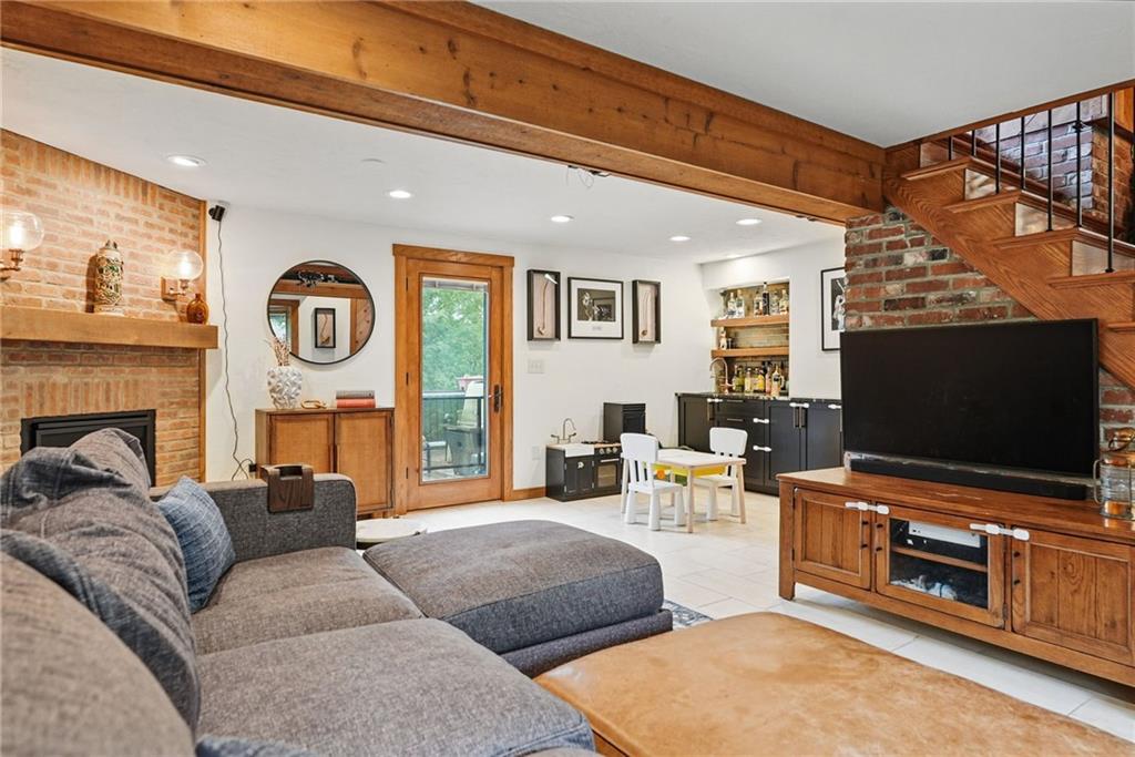 30 Club Road Carnegie, PA 15106 - Photo 11 of 49 a living room with furniture and a flat screen tv