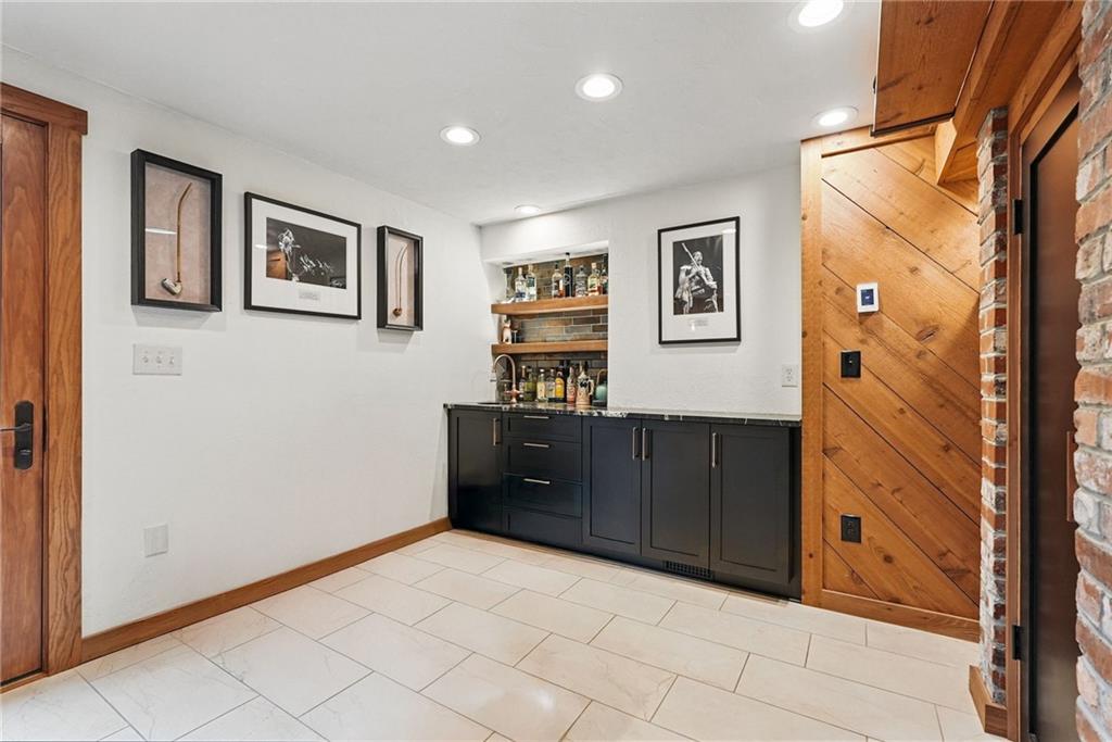 30 Club Road Carnegie, PA 15106 - Photo 13 of 49 a spacious bedroom with a dresser and paintings on the wall