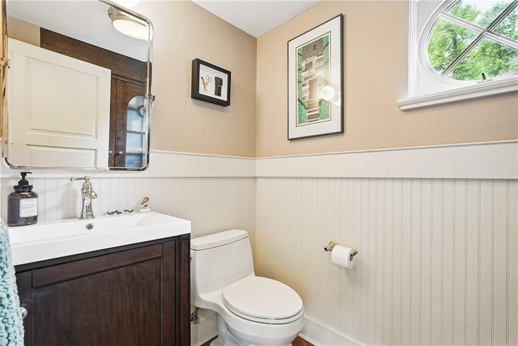 30 Club Road Carnegie, PA 15106 - Photo 15 of 49 a bathroom with a toilet a sink and mirror