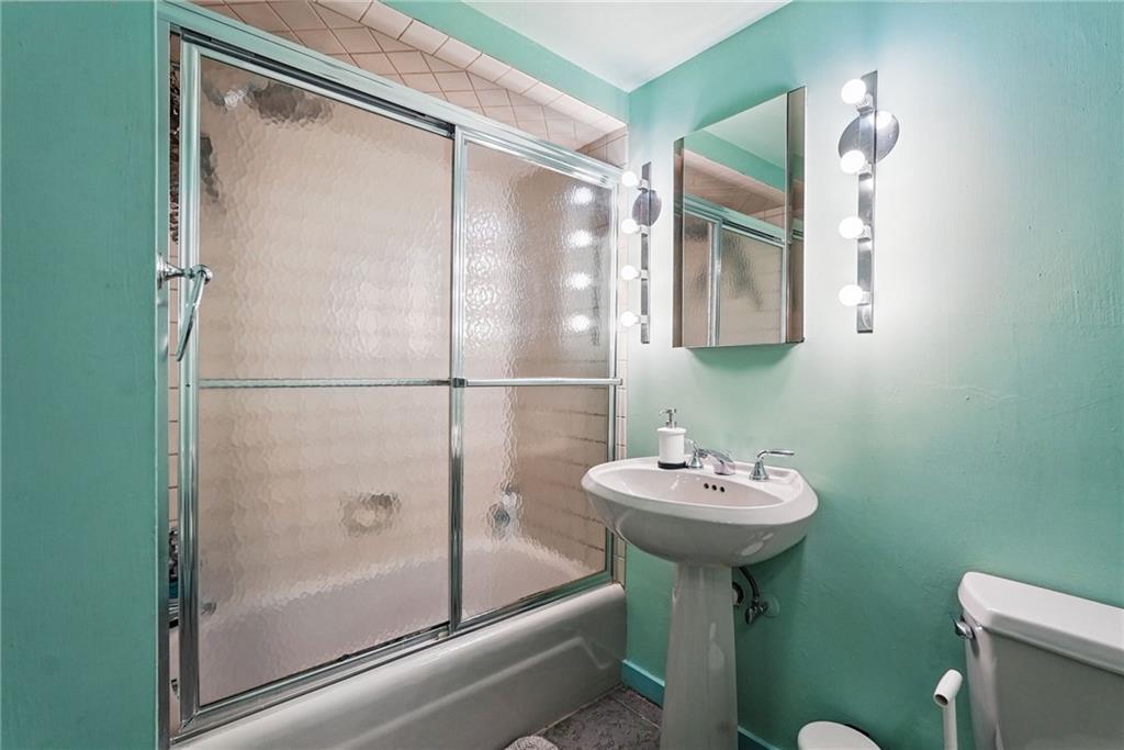 30 Club Road Carnegie, PA 15106 - Photo 31 of 49 a bathroom with a sink mirror and toilet