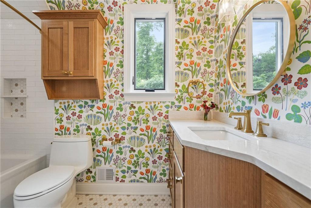 30 Club Road Carnegie, PA 15106 - Photo 33 of 49 a bathroom with a sink a toilet and a mirror