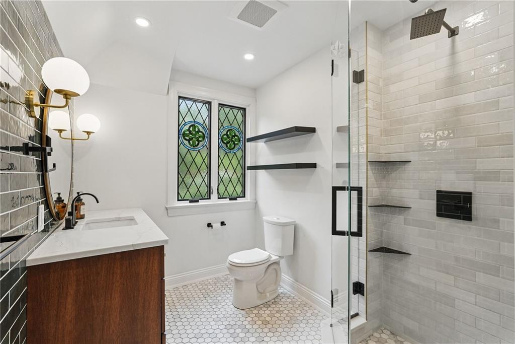 30 Club Road Carnegie, PA 15106 - Photo 38 of 49 a bathroom with a sink a toilet and shower