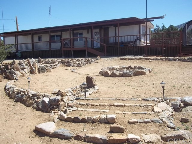 1118 Nielson Road Pinon Hills, CA 92372 - Photo 1 of 1 a view of a backyard of snow