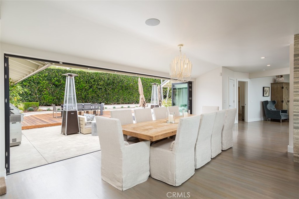 704 Emerald Bay Laguna Beach, CA 92651 - Photo 13 of 27 a dining room with furniture water view and a floor to ceiling window