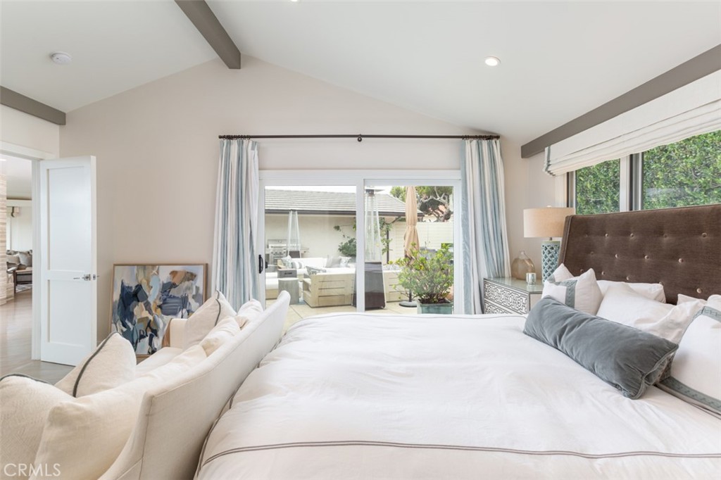 704 Emerald Bay Laguna Beach, CA 92651 - Photo 17 of 27 a large bedroom with a large bed and a large window