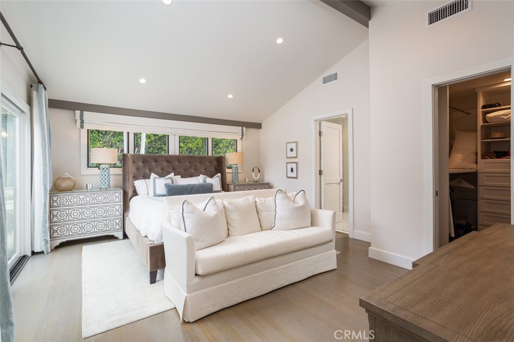 704 Emerald Bay Laguna Beach, CA 92651 - Photo 18 of 27 a living room with furniture large window and a wooden floor