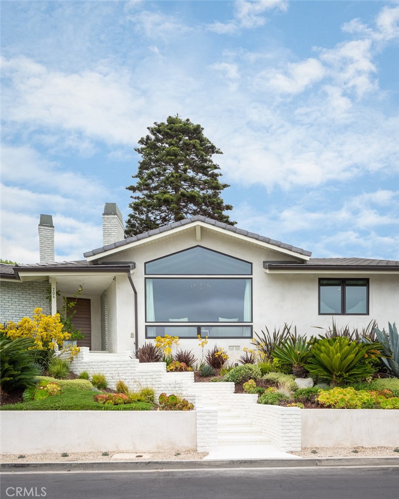 704 Emerald Bay Laguna Beach, CA 92651 - Photo 3 of 27 front view of house with a yard
