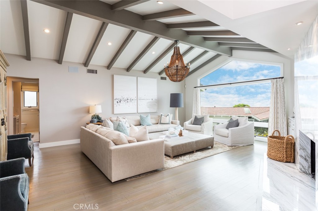 704 Emerald Bay Laguna Beach, CA 92651 - Photo 7 of 27 a living room with furniture and a large window