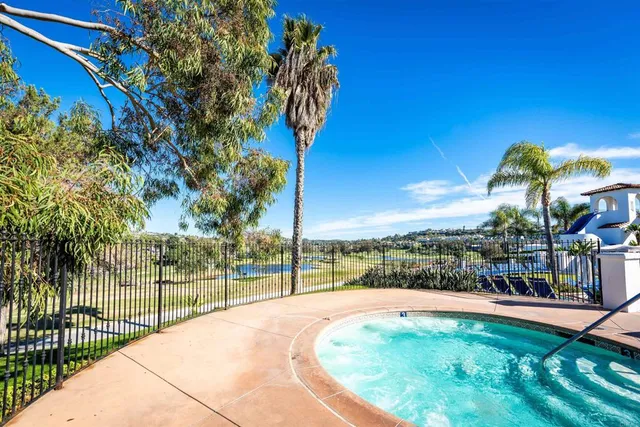 a view of a swimming pool with a patio