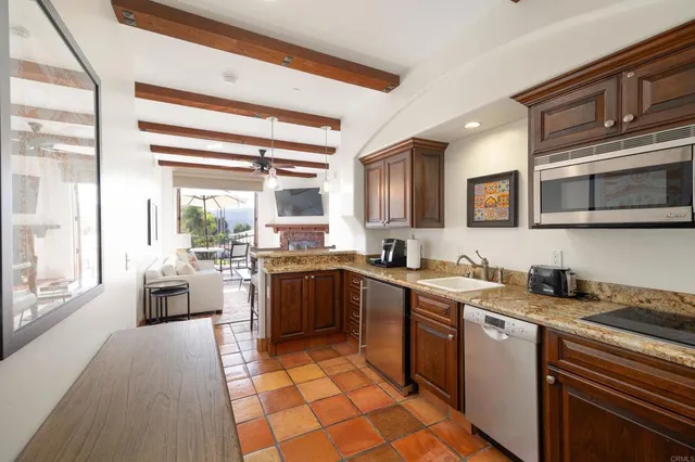 a kitchen with a sink stove and microwave