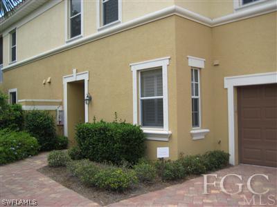 13002 Pennington Place, Unit 101 Fort Myers, FL 33913 - Photo 10 of 10 a front view of a house with a yard