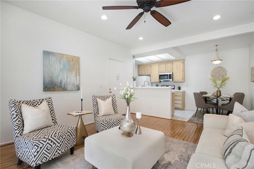 20702 El Toro Road, Unit 379 Lake Forest, CA 92630 - Photo 3 of 45 Living room flows seamlessly with kitchen and dining area