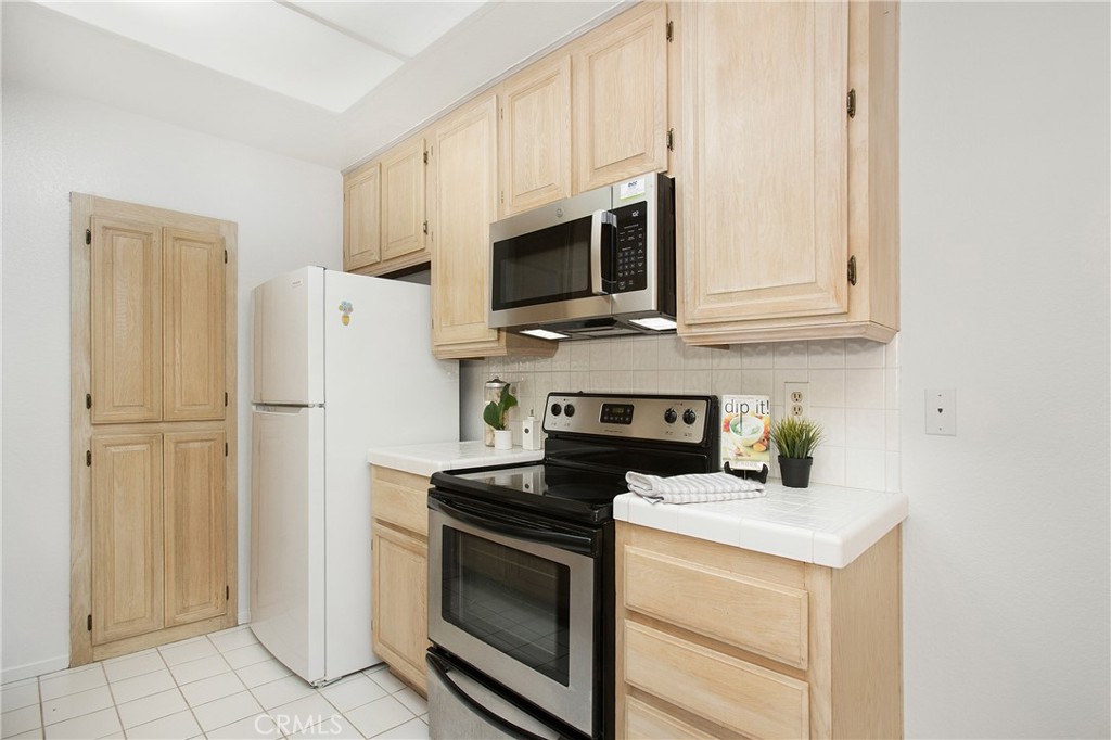 20702 El Toro Road, Unit 379 Lake Forest, CA 92630 - Photo 5 of 45 Ample cupboard space and mostly stainless appliances