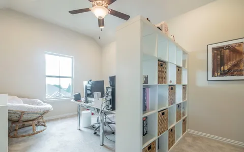 a view of a workspace with furniture