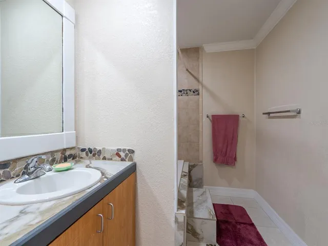 a bathroom with a sink and a mirror