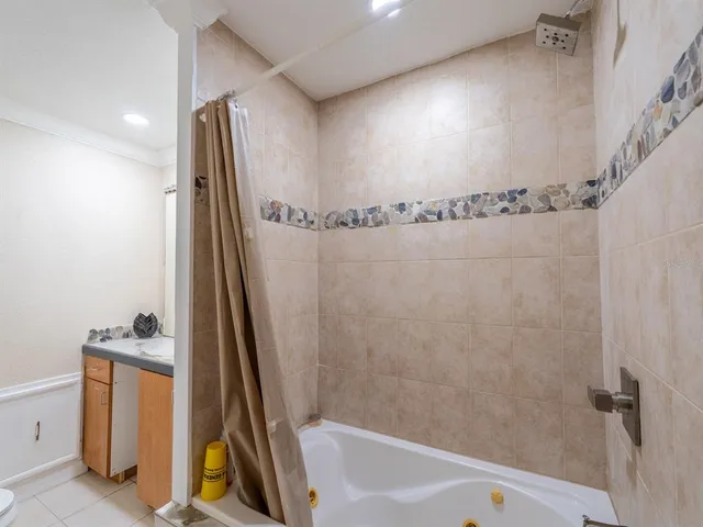 a bathroom with a shower and a tub