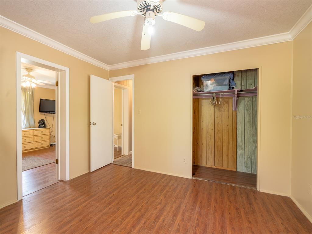 13455 Northeast 228 Ln Road Fort McCoy, FL 32134 - Photo 26 of 51 a view of empty room with wooden floor