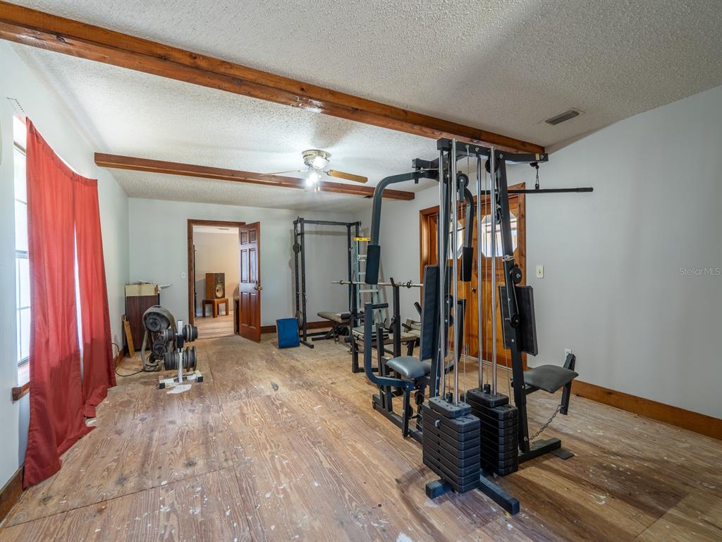 13455 Northeast 228 Ln Road Fort McCoy, FL 32134 - Photo 27 of 51 a view of a room with gym equipment