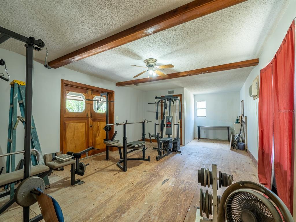 13455 Northeast 228 Ln Road Fort McCoy, FL 32134 - Photo 28 of 51 a view of a livingroom with furniture and a window