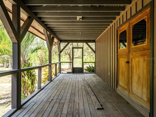 a view of balcony with wooden floor