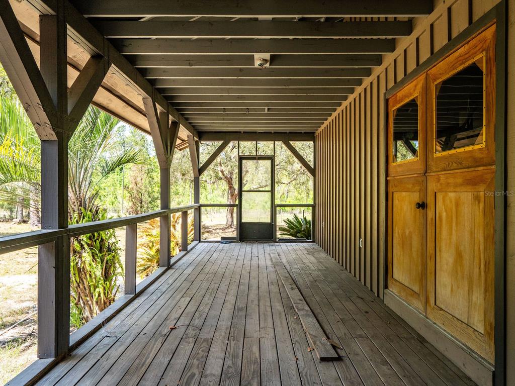 13455 Northeast 228 Ln Road Fort McCoy, FL 32134 - Photo 29 of 51 a view of balcony with wooden floor
