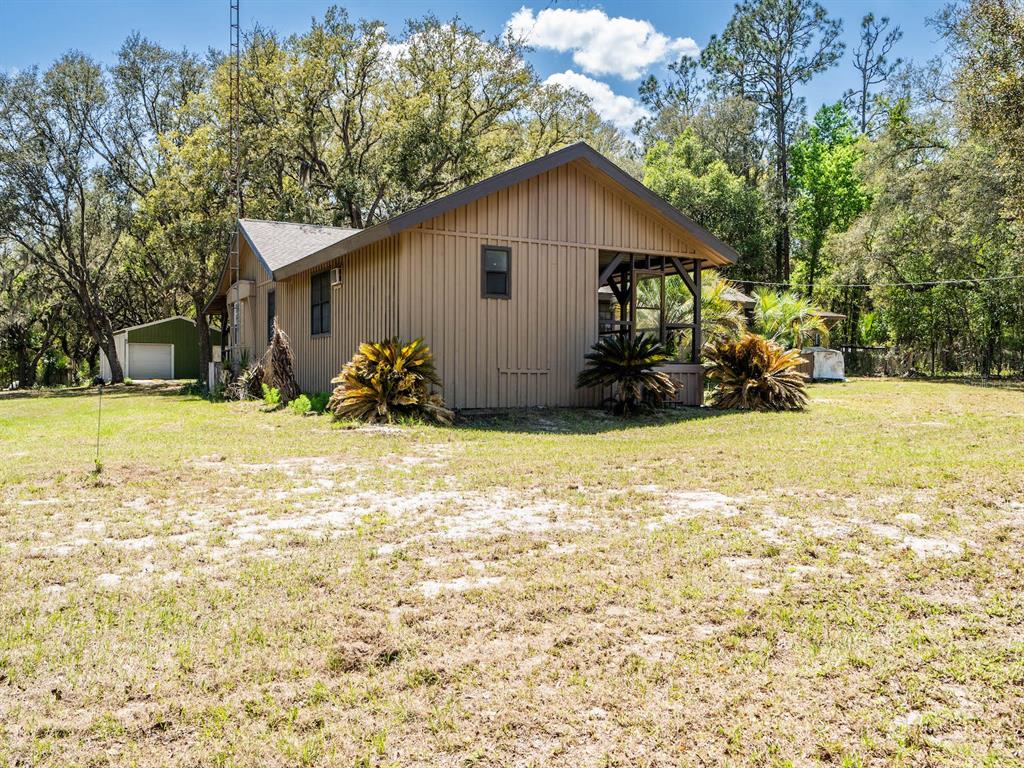 13455 Northeast 228 Ln Road Fort McCoy, FL 32134 - Photo 34 of 51 a view of a house with a yard