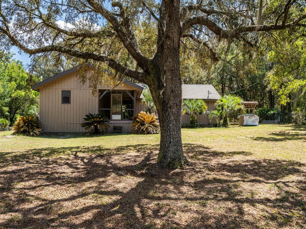13455 Northeast 228 Ln Road Fort McCoy, FL 32134 - Photo 35 of 51 a house view with a outdoor space