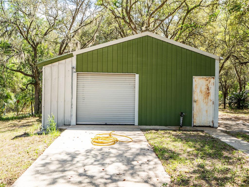 13455 Northeast 228 Ln Road Fort McCoy, FL 32134 - Photo 38 of 51 a house with a small yard