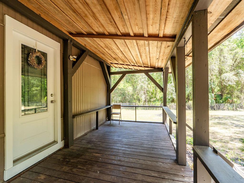 13455 Northeast 228 Ln Road Fort McCoy, FL 32134 - Photo 7 of 51 a view of an entryway with wooden floor