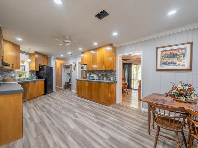 a view of kitchen with cabinets and wooden floor