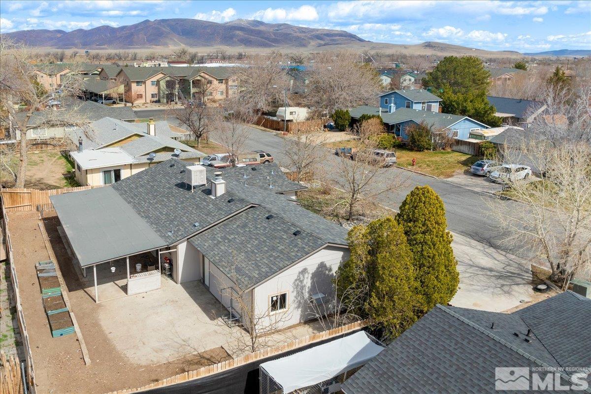 350 Sycamore Street Fernley, NV 89408 - Photo 21 of 24 a aerial view of a house with a yard and lake view