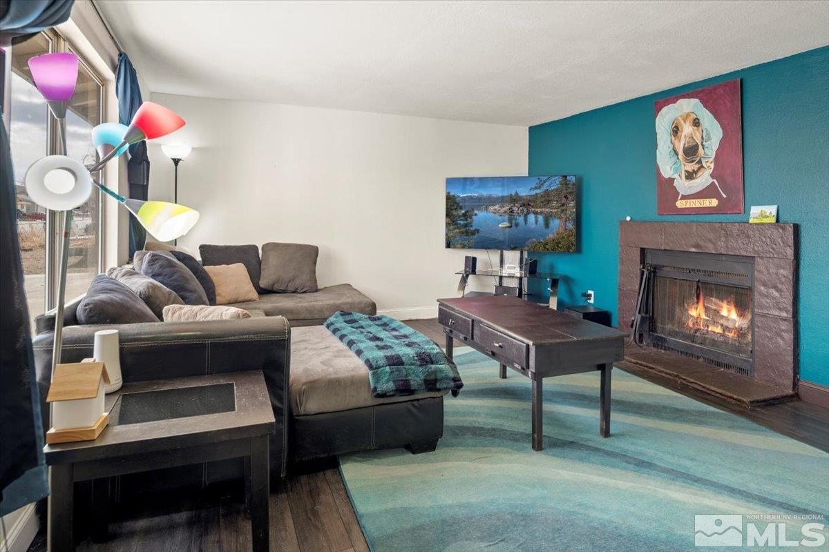 350 Sycamore Street Fernley, NV 89408 - Photo 4 of 24 a living room with furniture and a fireplace