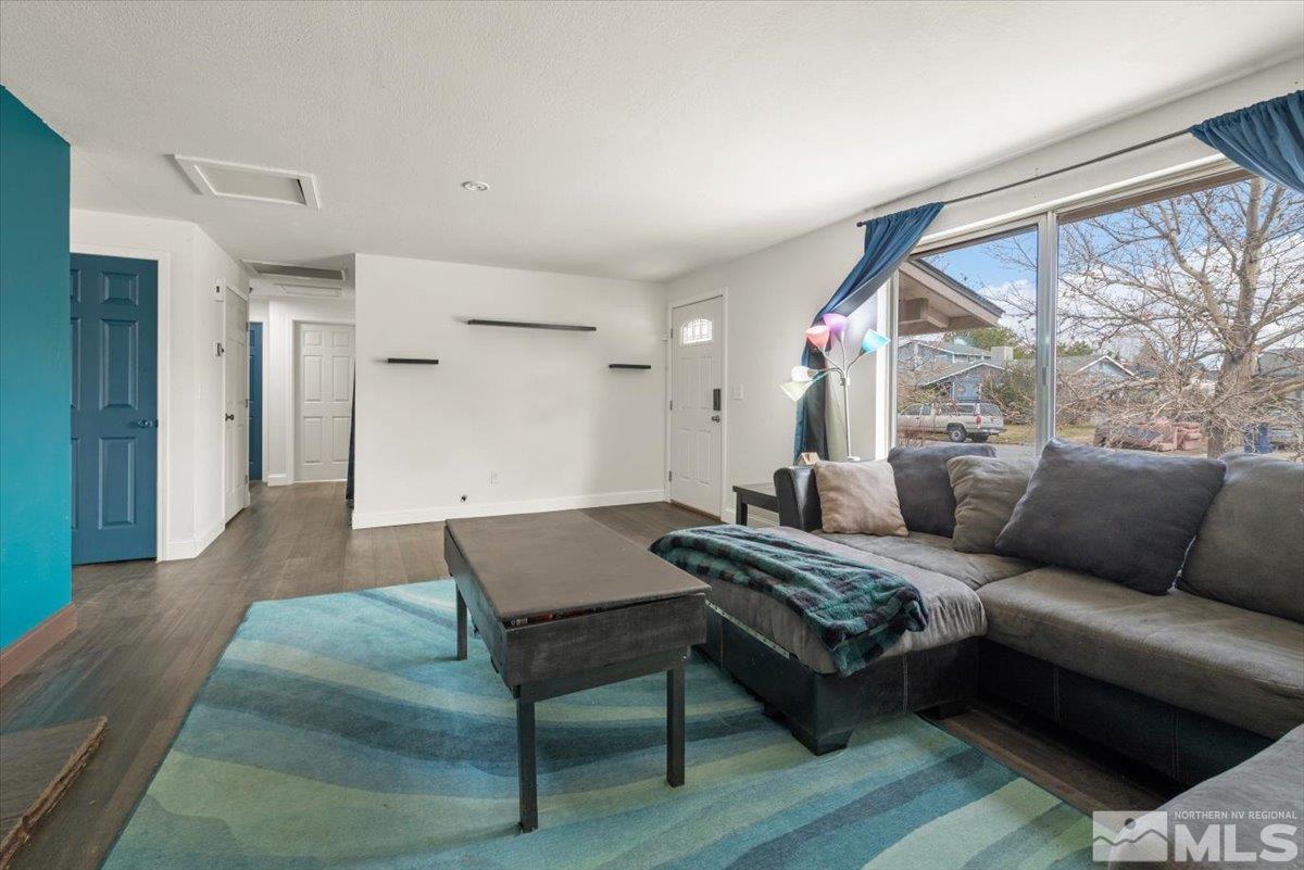 350 Sycamore Street Fernley, NV 89408 - Photo 5 of 24 a living room with furniture and a large window