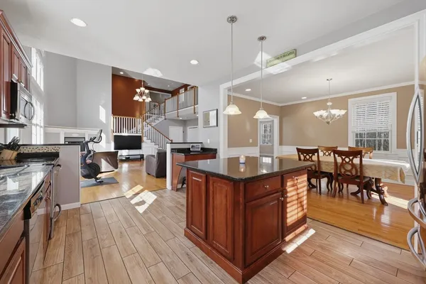 a large kitchen with lots of counter space and stainless steel appliances