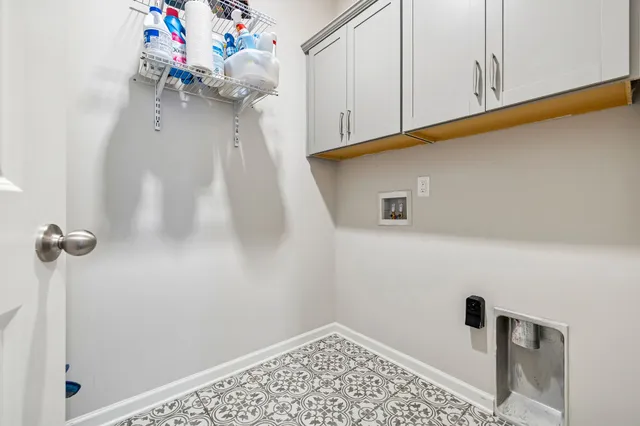 a view of a storage & utility room with a window