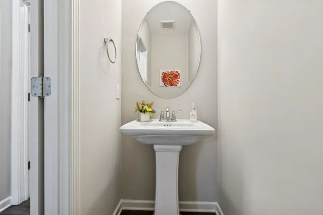 a bathroom with a sink and mirror