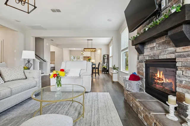 a living room with furniture and a fireplace