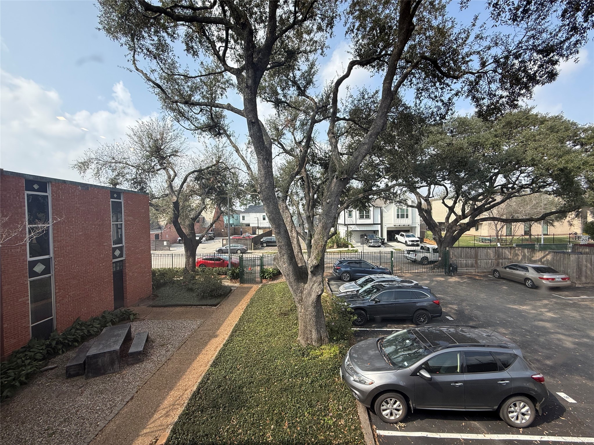 1112 Lawrence Street, Unit 15 Houston, TX 77008 - Photo 6 of 6 a car parked in front of a house