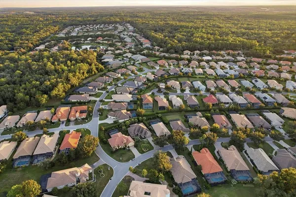 an aerial view of residential houses with outdoor space