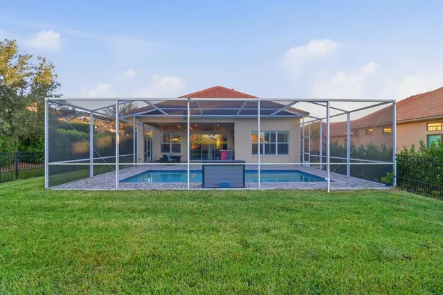 a view of an house with backyard and porch