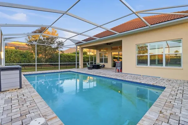 a view of a backyard with a swimming pool