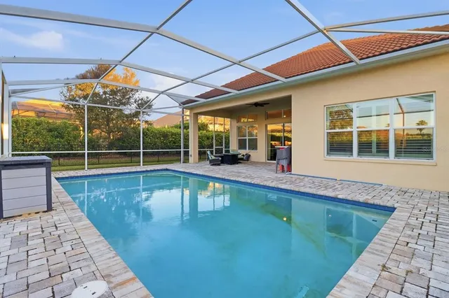 a view of a backyard with a swimming pool