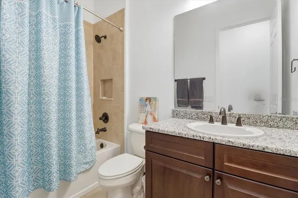 a bedroom with furniture and a fireplace