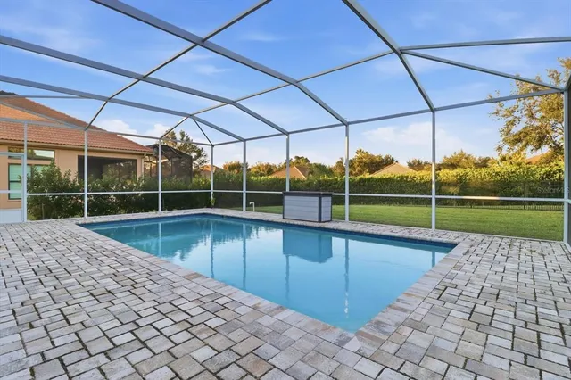 a view of a backyard with swimming pool