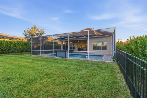 a view of a house with backyard and porch