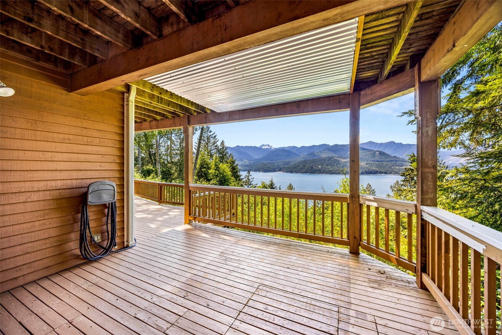 19736 Northwest Stavis Bay Road Seabeck, WA 98380 - Photo 33 of 39 a view of a balcony with wooden floor