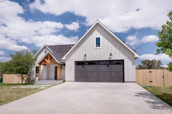 a view of house with outdoor space in front of it