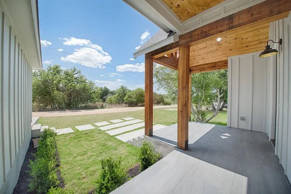 a view of a balcony with yard