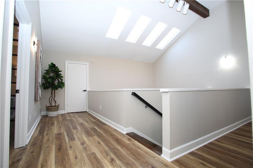 4830 Rebel Trail Sandy Springs, GA 30327 - Photo 39 of 75 wooden floor in an empty room with a window