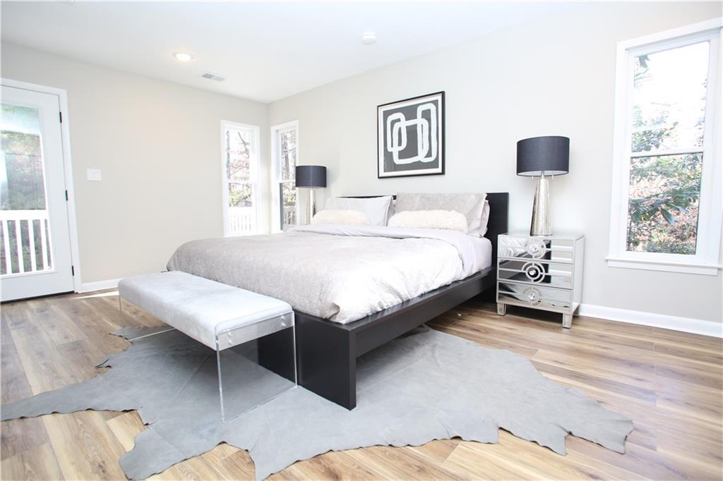 4830 Rebel Trail Sandy Springs, GA 30327 - Photo 54 of 75 a bedroom with a bed and a table